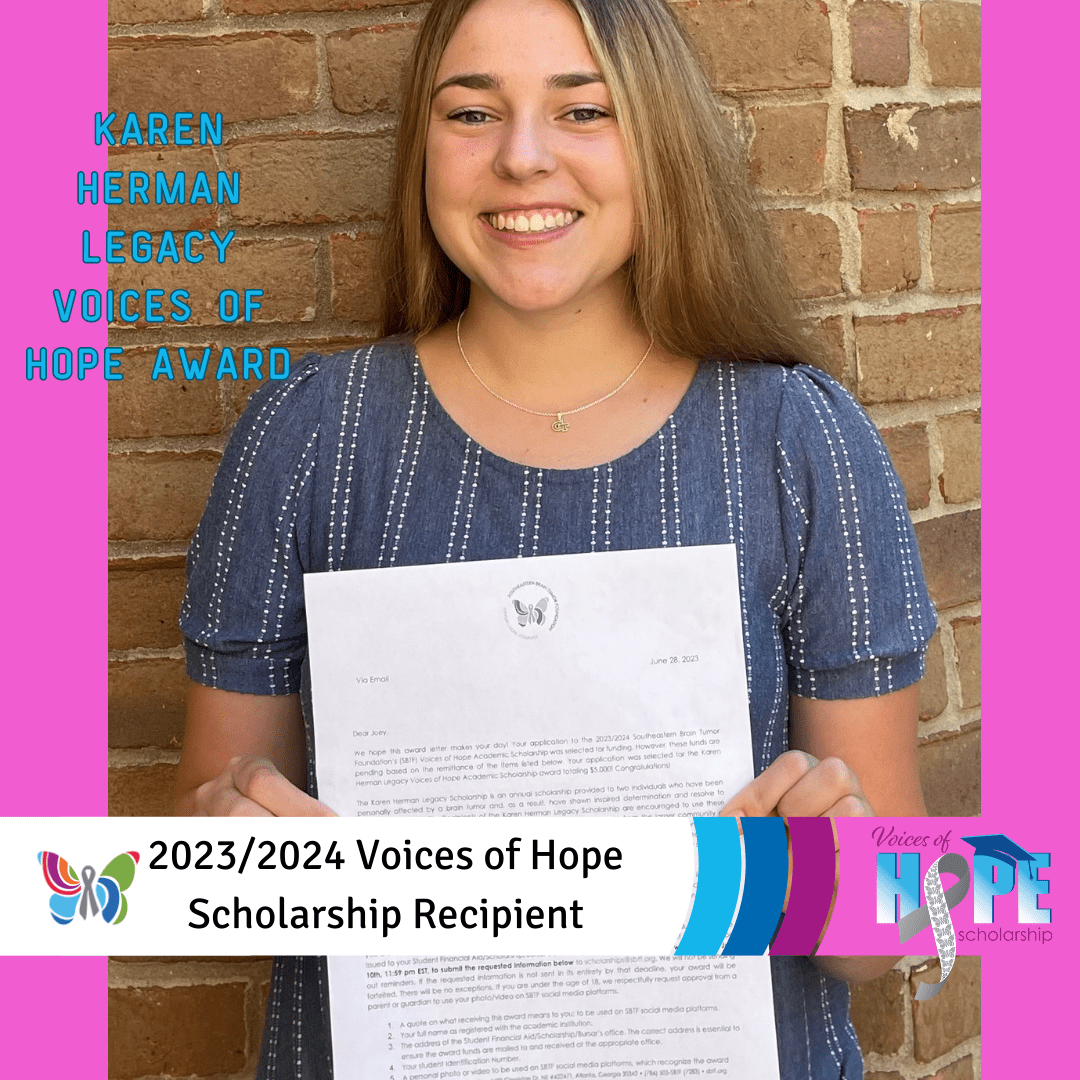 A young girl standing with a paper and awarded voices of hope scholarship recipient